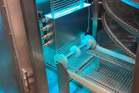 Stainless steel belt in spiral cooler with UVC light